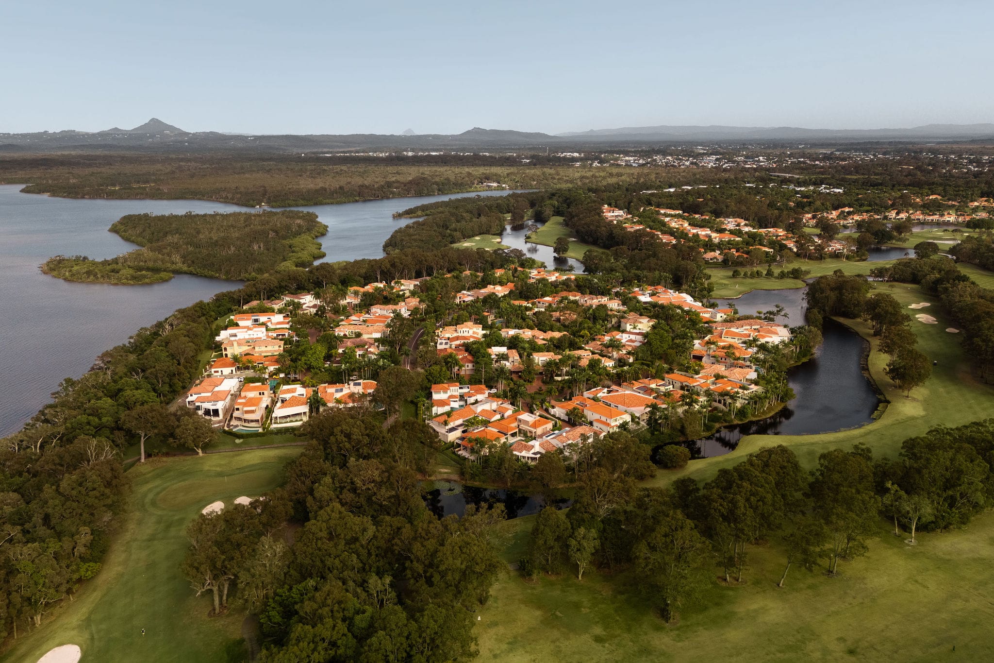 Noosa Heads coastline and bushland from above — the Sunshine Coast region in 2026.